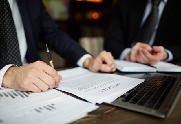 businessman-reading-contract-closeup (1) businessman-reading-contract-closeup (1)